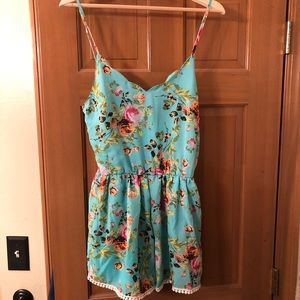 Teal floral romper with pockets
